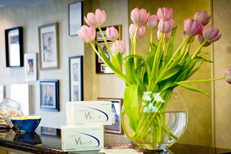 Bouquet of flowers on receptionists desk at Cramer Dental in Blue Bell, PA 