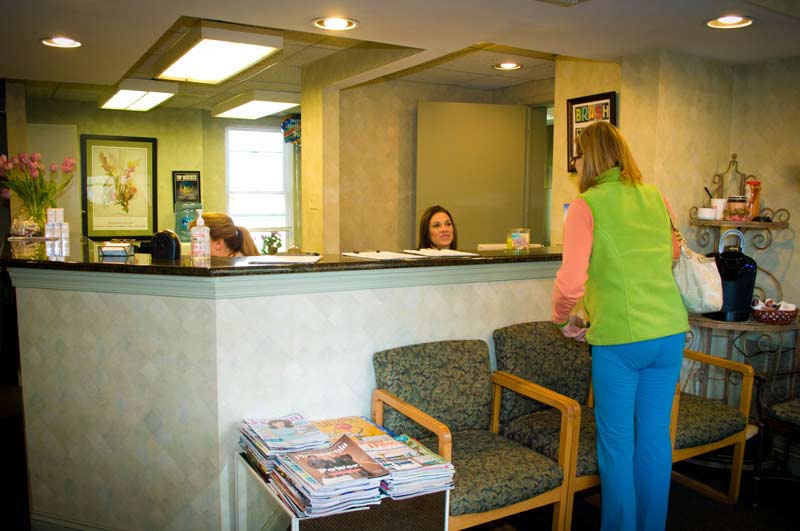 Patient checking in for their dental exam at Cramer Dental in Blue Bell, PA