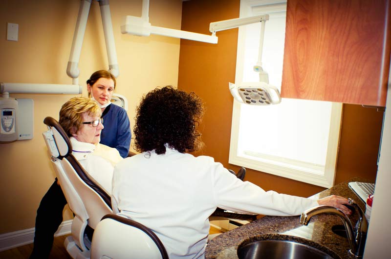 Patient talking with dental assistant and the doctor at Cramer Dental in Blue Bell, PA